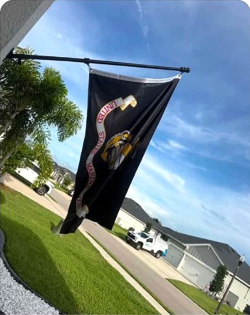 Lane's Marine Corps flag, flying proudly from his porch.